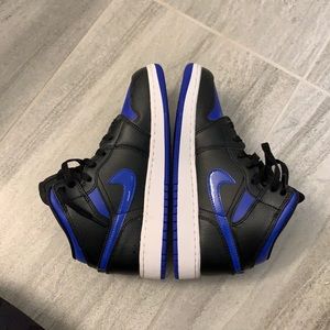 Blue and black air Jordan 1 mids